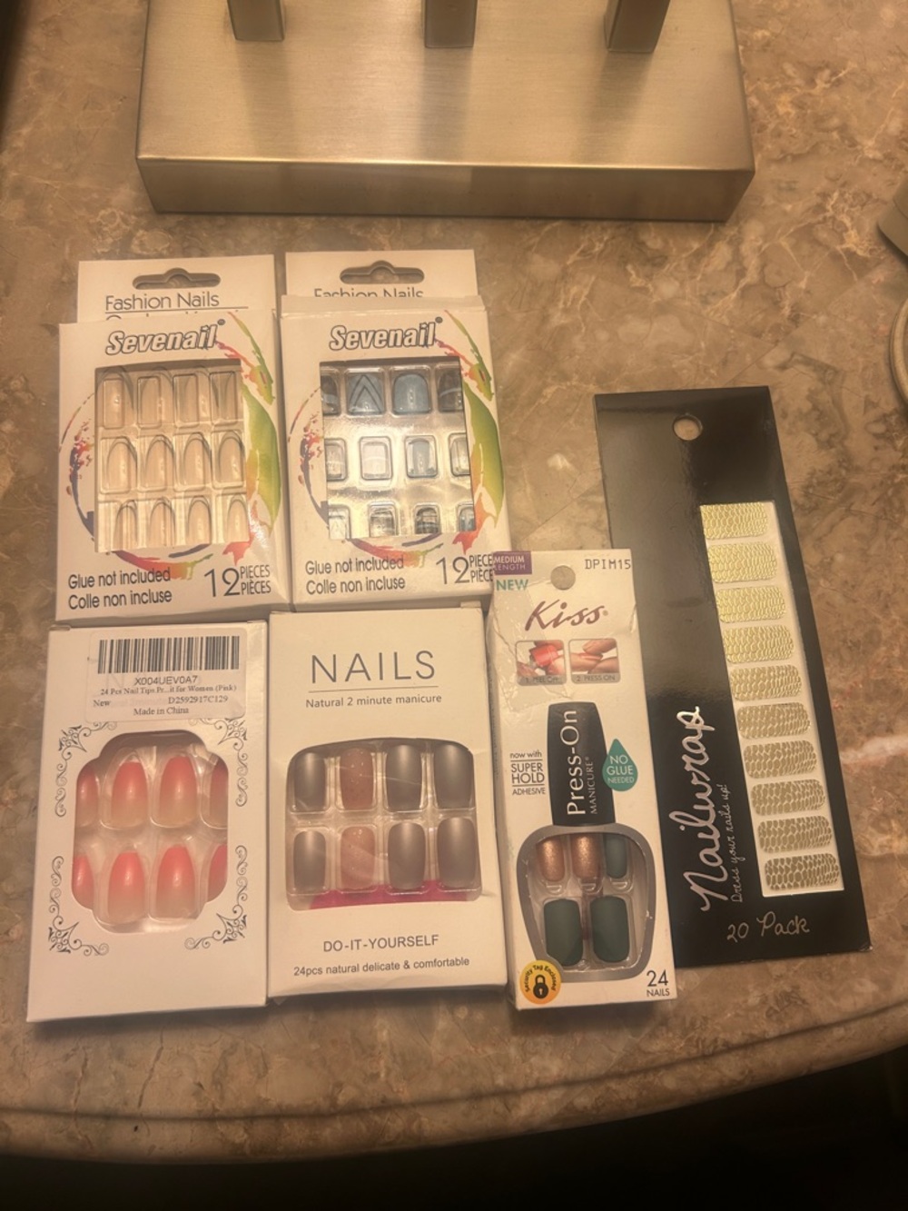 1 pack of Kiss Press-On Nail and Assortment Pack of other brands.